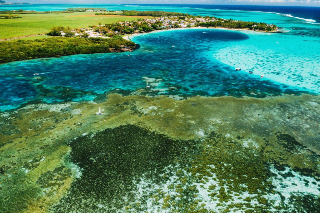 Aerial photography of the East coast of the island of Mauritius. Beautiful lagoon of the island of Mauritius, taken from above.Indian ocean coral reef Aerial photography of the East coast of the island of Mauritius. Beautiful lagoon of the island of Mauritius, taken from above.Indian ocean coral reef
