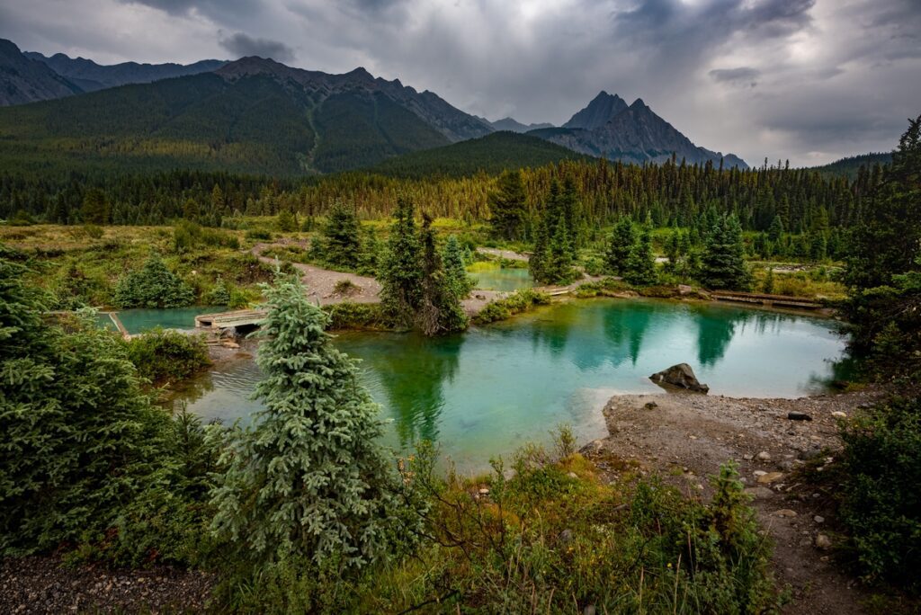 Ink Pots, Banff Alberta. Rain-kissed landscapes come alive in a Ink Pots, Banff Alberta. Rain-kissed landscapes come alive in a
