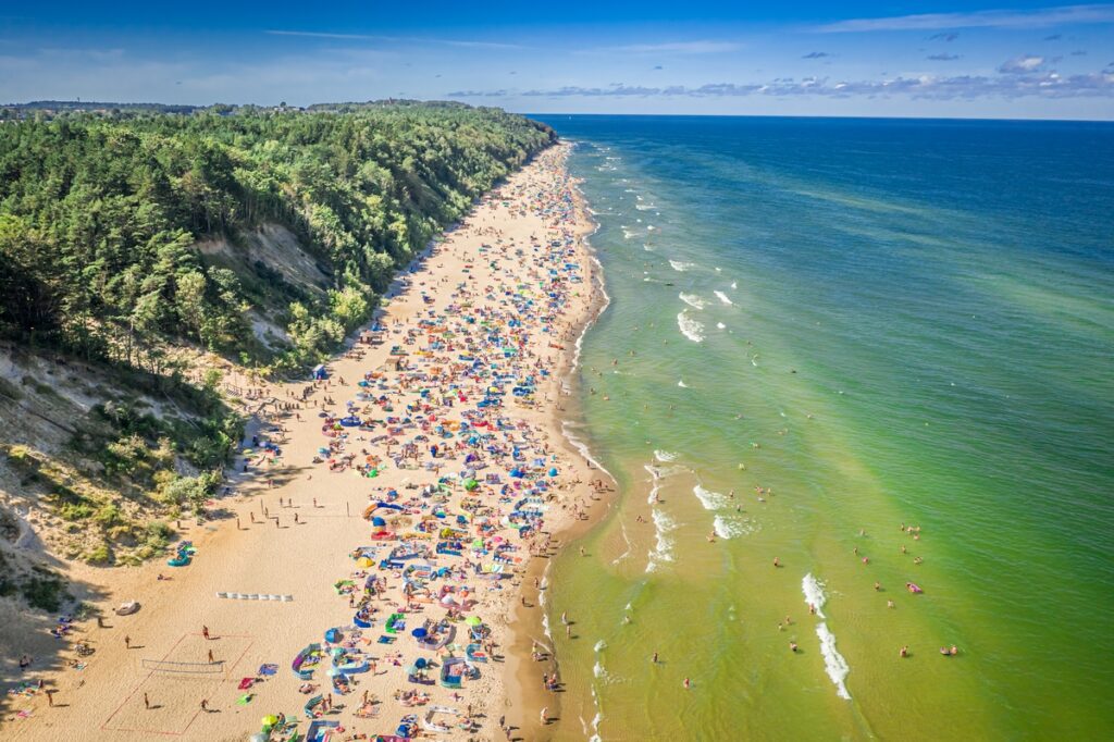 Crowded beach on Baltic Sea in summer, aerial view Crowded beach on Baltic Sea in summer, aerial view