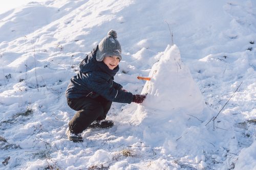 Little boy playing with snow. Winter holiday Little boy playing with snow. Winter holiday
